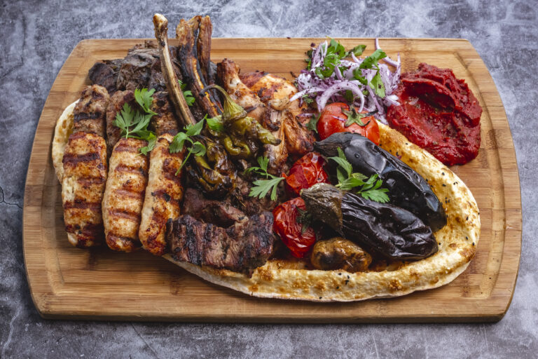 kebab platter with lamb and chicken lula and tikka kebabs grilled vegetables with red onion salad