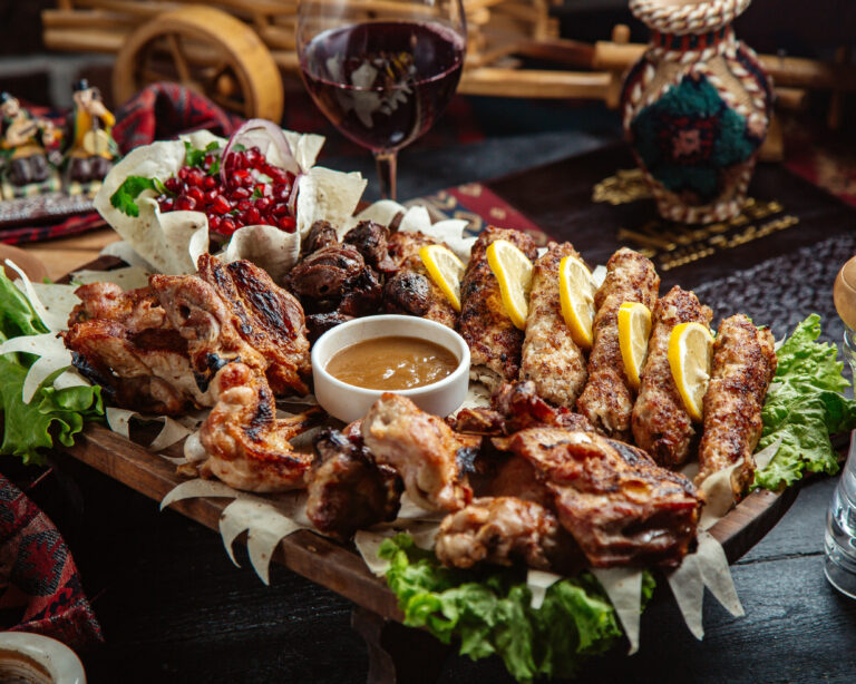 mixed fried meat with pomegranate and sauce